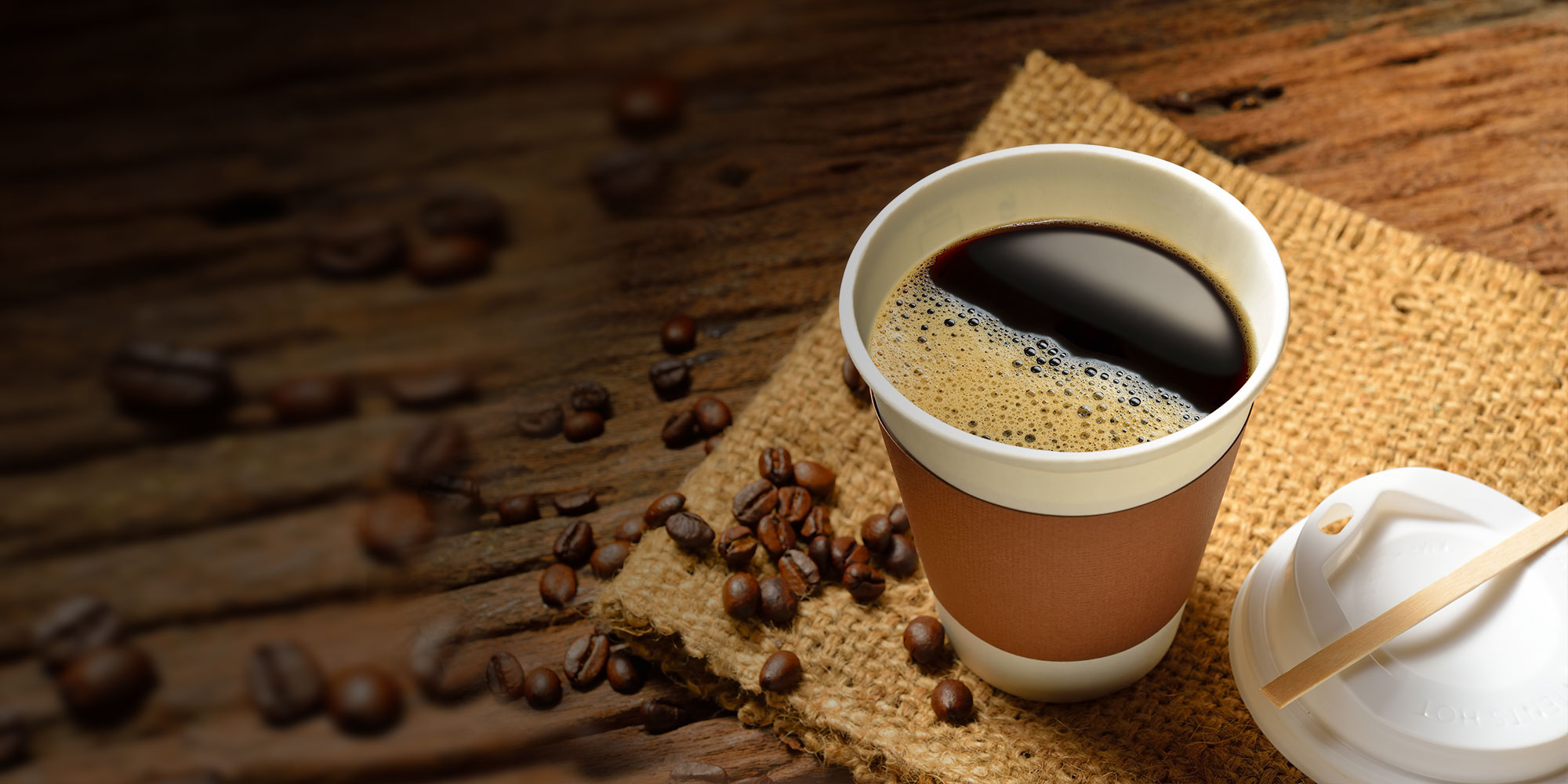 Hot cup of coffee on an office desk