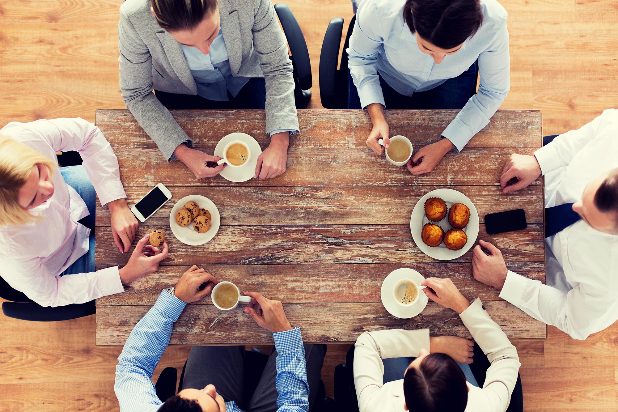 Employees meeting with coffee and snacks