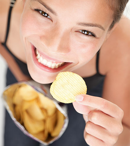 Happy employee eating a snack